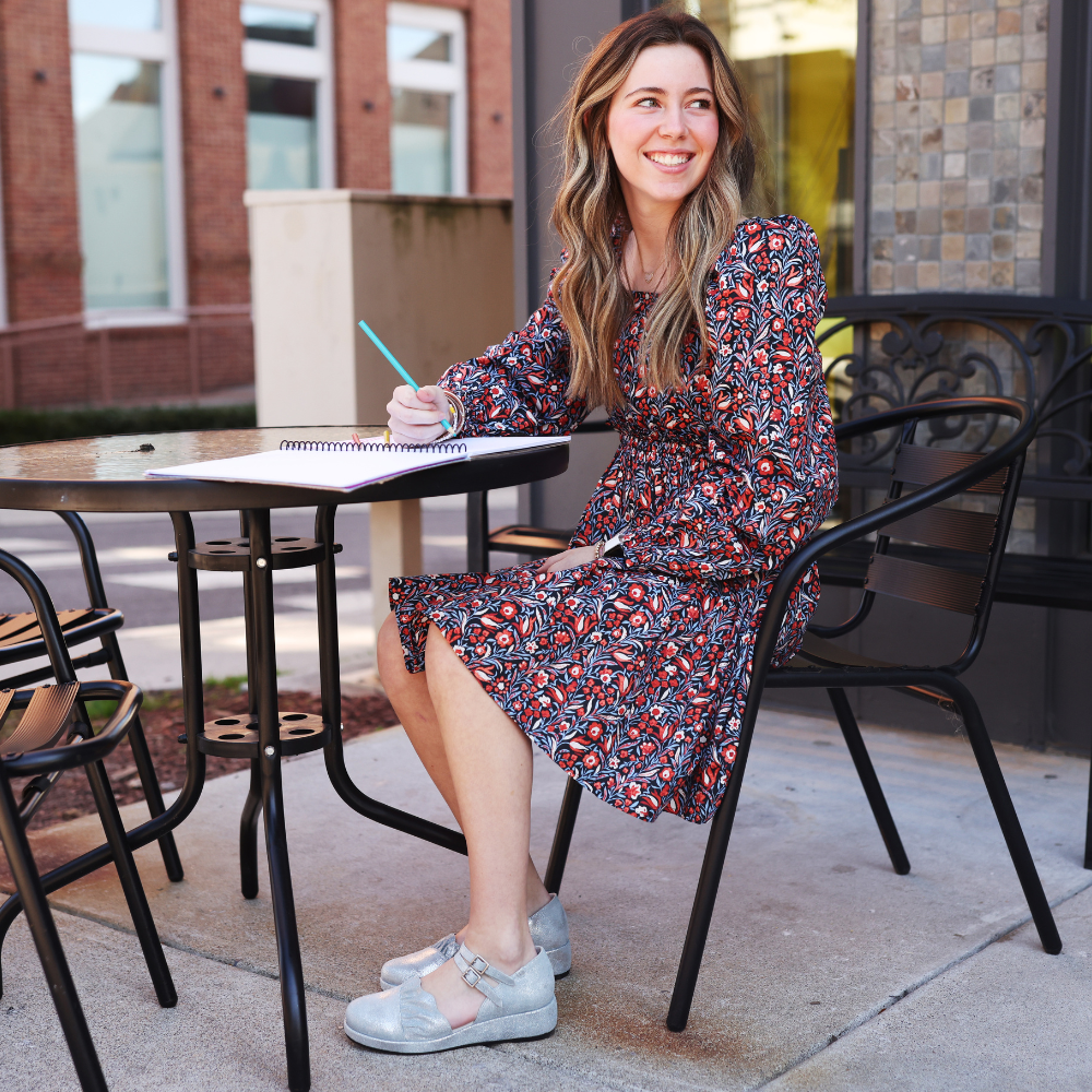 QUADSis Elizabeth Mary Janes Silver.  Comfortable, sustainable, low heel wedge with adjustable double strap.  Denim, genuine leather, and patent materials with cork & leather midsole.
