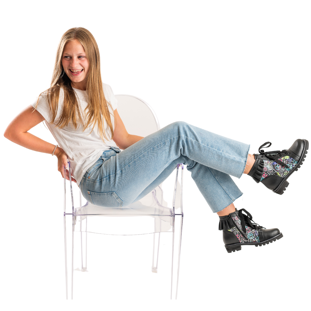 QUADSis Brooke Boot Graffiti. Comfortable, sustainable, lightweight, low heel, lug sole boot with working laces and side entry zipper and ruffle collar. Genuine leather with graffiti print and black silver glitter.