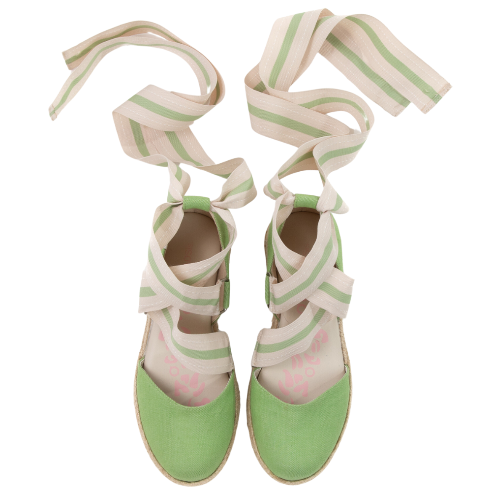 QUADSis Elaine Too Espadrille Wedge Green Apple. Comfortable, sustainable, low heel wedge with adjustable grosgrain ribbon and jute wrap. Canvas. Chambray and green apple.
