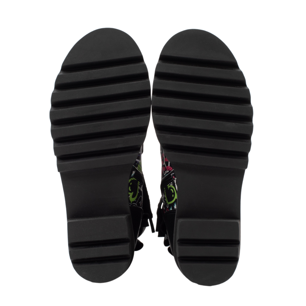 QUADSis Brooke Boot non-skid sole Bottoms. Comfortable, sustainable, lightweight, low heel, lug sole boot with working laces and side entry zipper and ruffle collar. Genuine leather with graffiti print and black silver glitter.