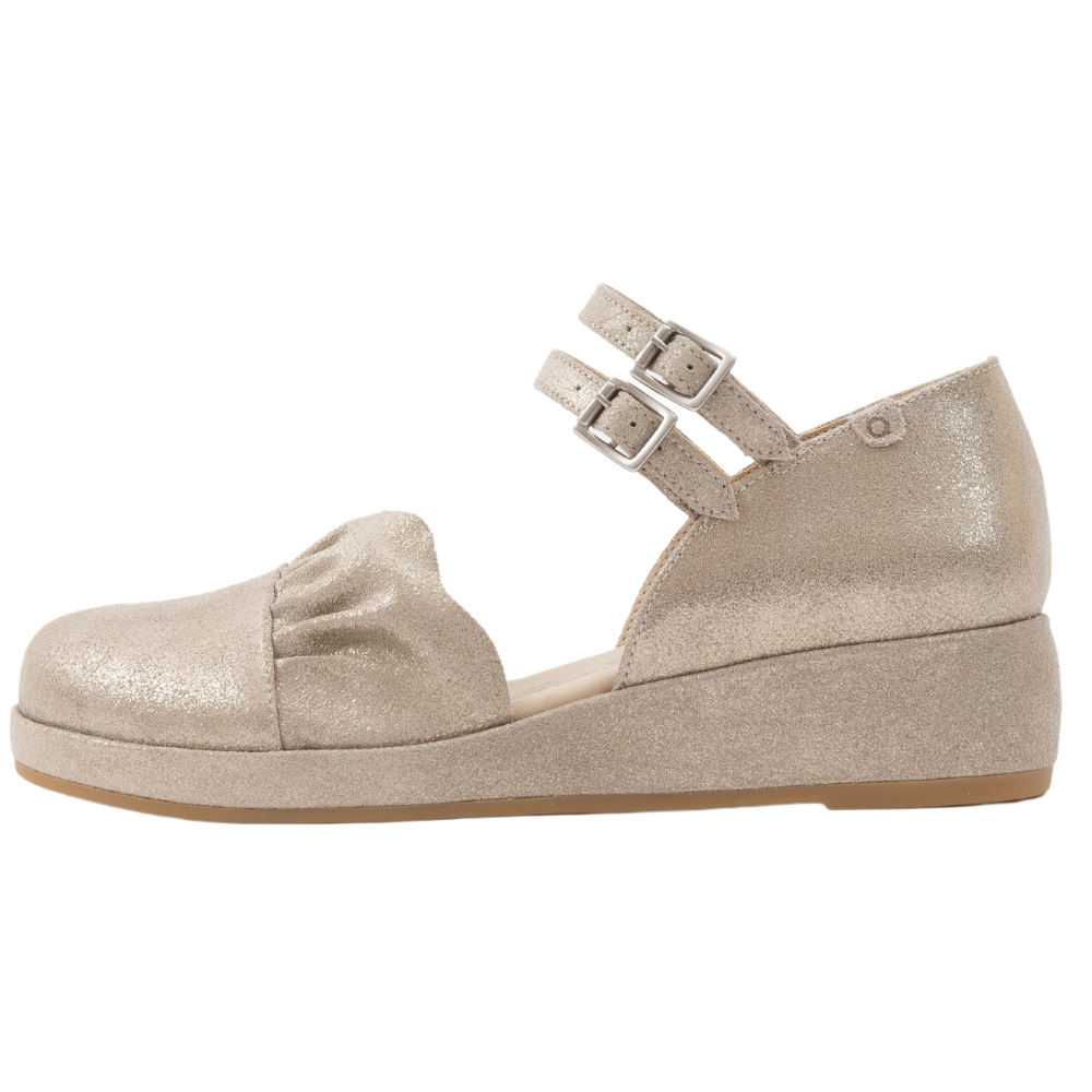 QUADSis Elizabeth Mary Janes Gilver.  Comfortable, sustainable, low heel wedge with adjustable double strap.  Denim, genuine leather, and patent materials with cork & leather midsole. Shimmer suede.