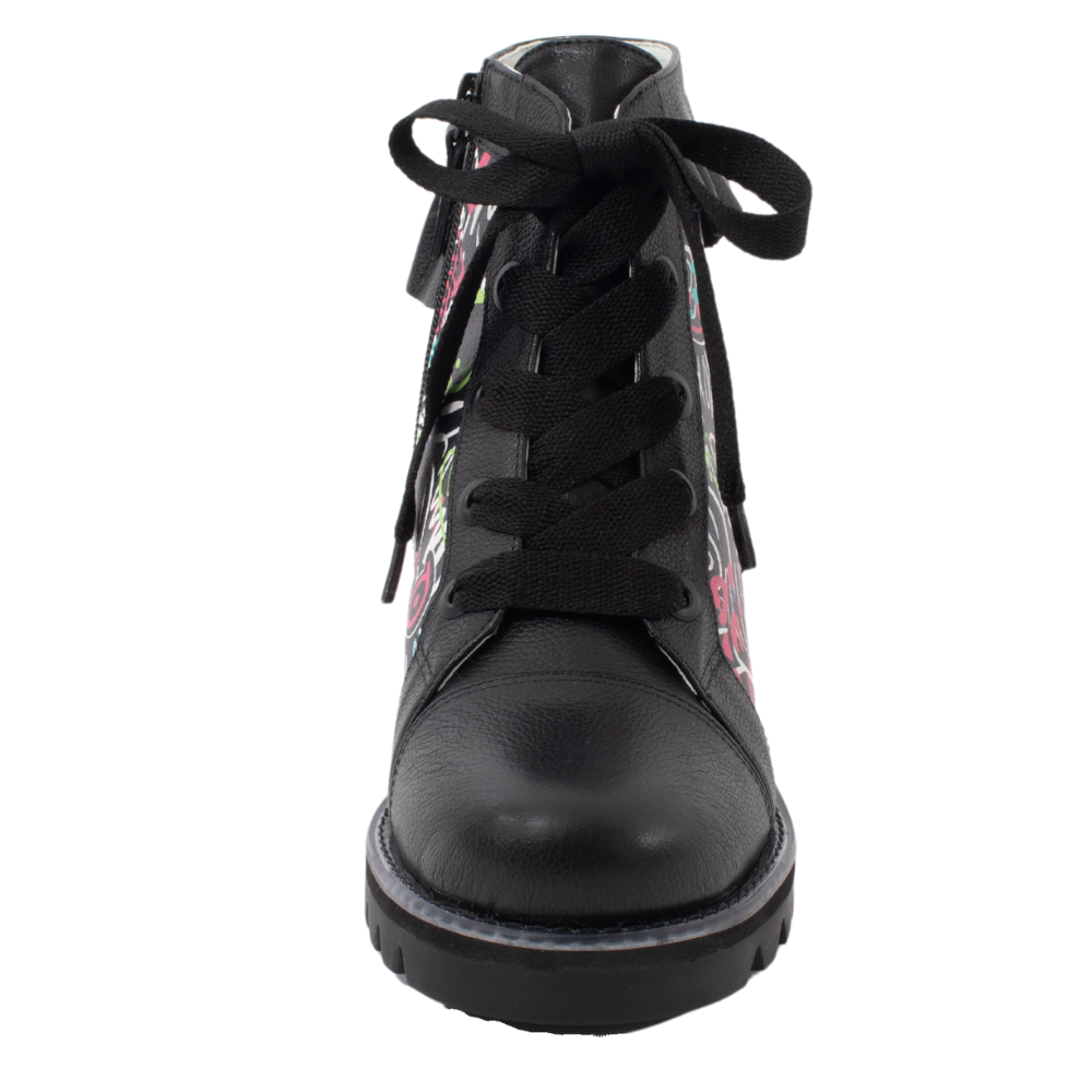 QUADSis Brooke Boot Graffiti. Comfortable, sustainable, lightweight, low heel, lug sole boot with working laces and side entry zipper and ruffle collar. Genuine leather with graffiti print and black silver glitter.