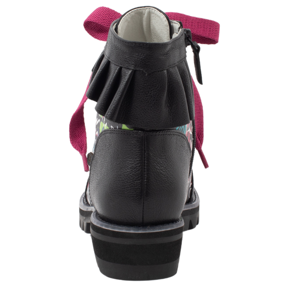QUADSis Brooke Boot Graffiti. Comfortable, sustainable, lightweight, low heel, lug sole boot with working laces and side entry zipper and ruffle collar. Genuine leather with graffiti print and black silver glitter.