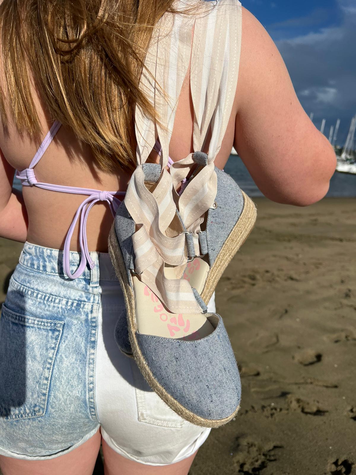 QUADSis Elaine Too Espadrille Wedge Chambray. Comfortable, sustainable, low heel wedge with adjustable grosgrain ribbon and jute wrap. Canvas.