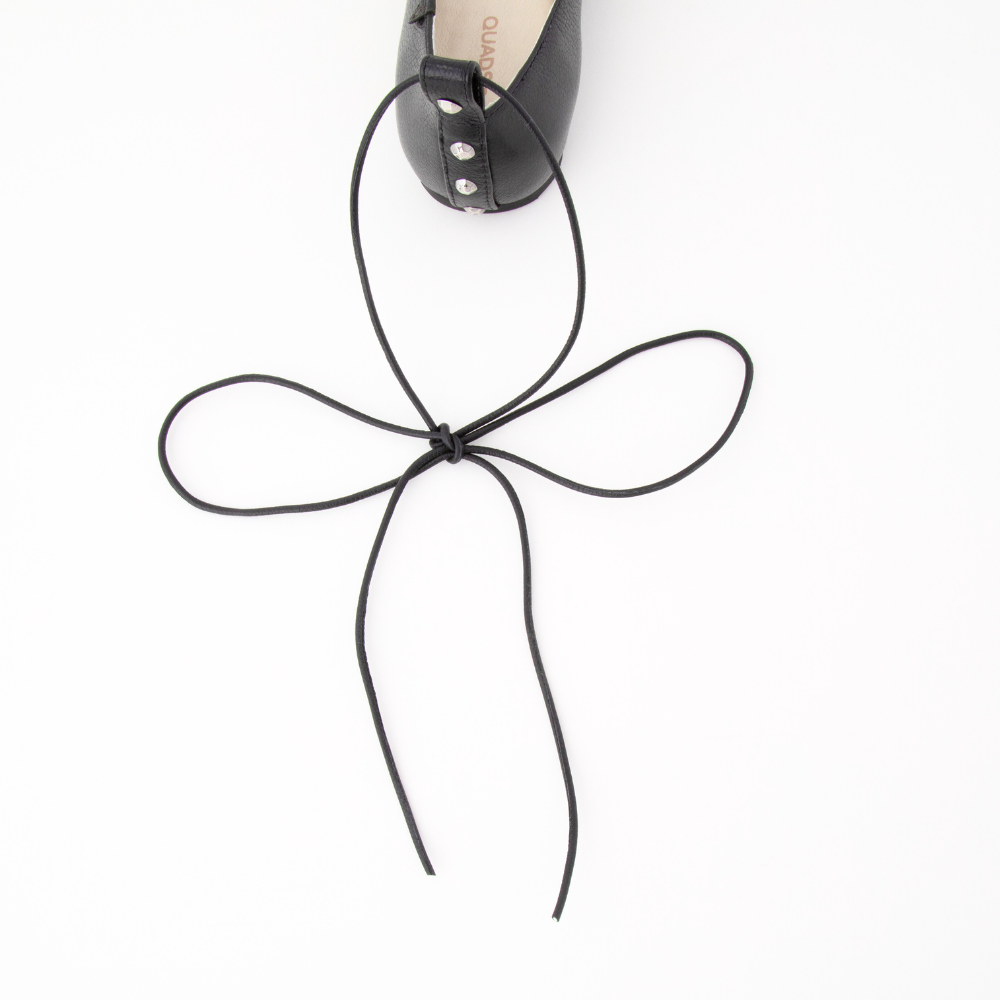 QUADSis Ballet flat Black. Comfortable, sustainable, and lightweight with removeable leather tie. Genuine leather in black and soft gold.