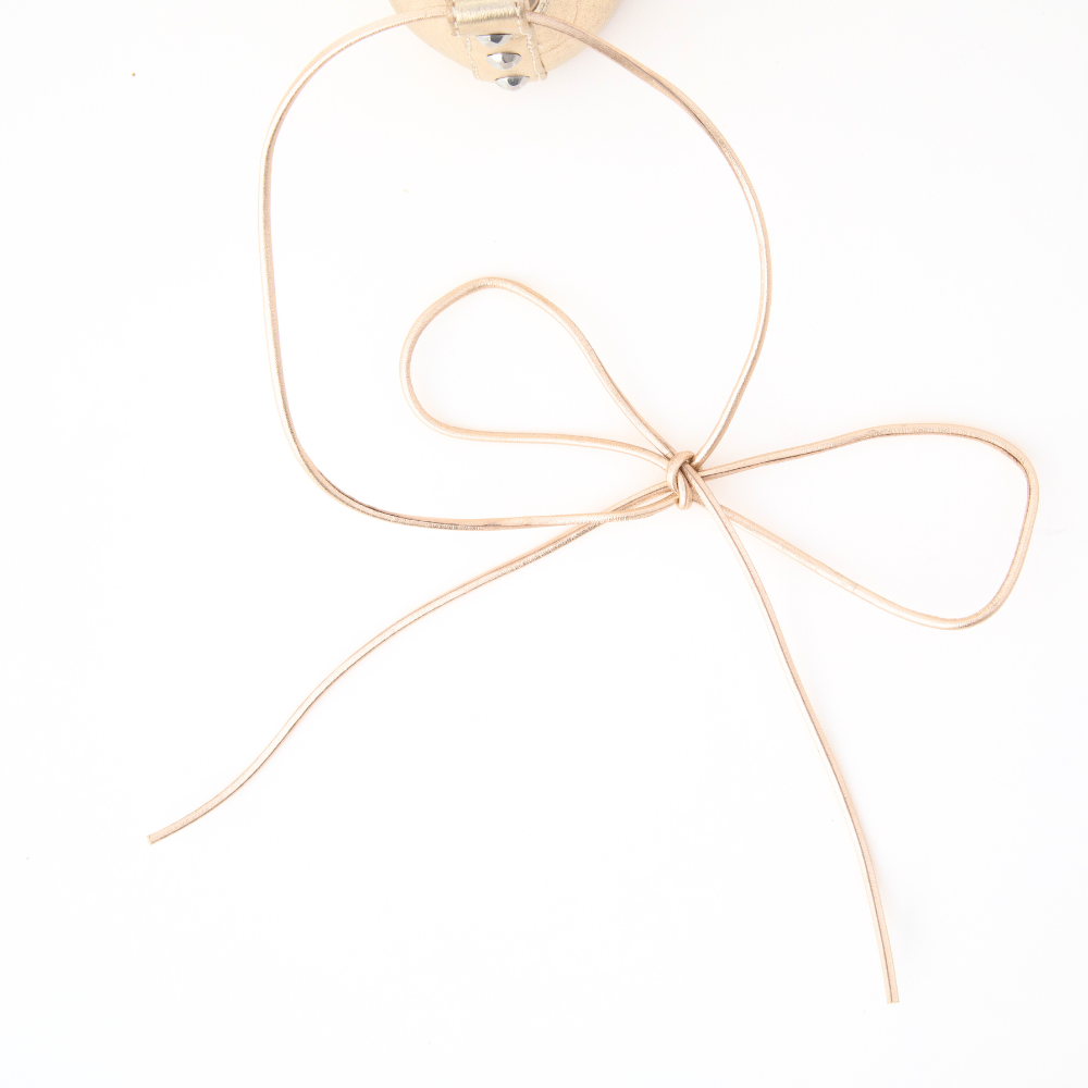 QUADSis Ballet flat Black. Comfortable, sustainable, and lightweight with removeable leather tie. Genuine leather in black and soft gold.