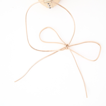 QUADSis Ballet flat Black. Comfortable, sustainable, and lightweight with removeable leather tie. Genuine leather in black and soft gold.