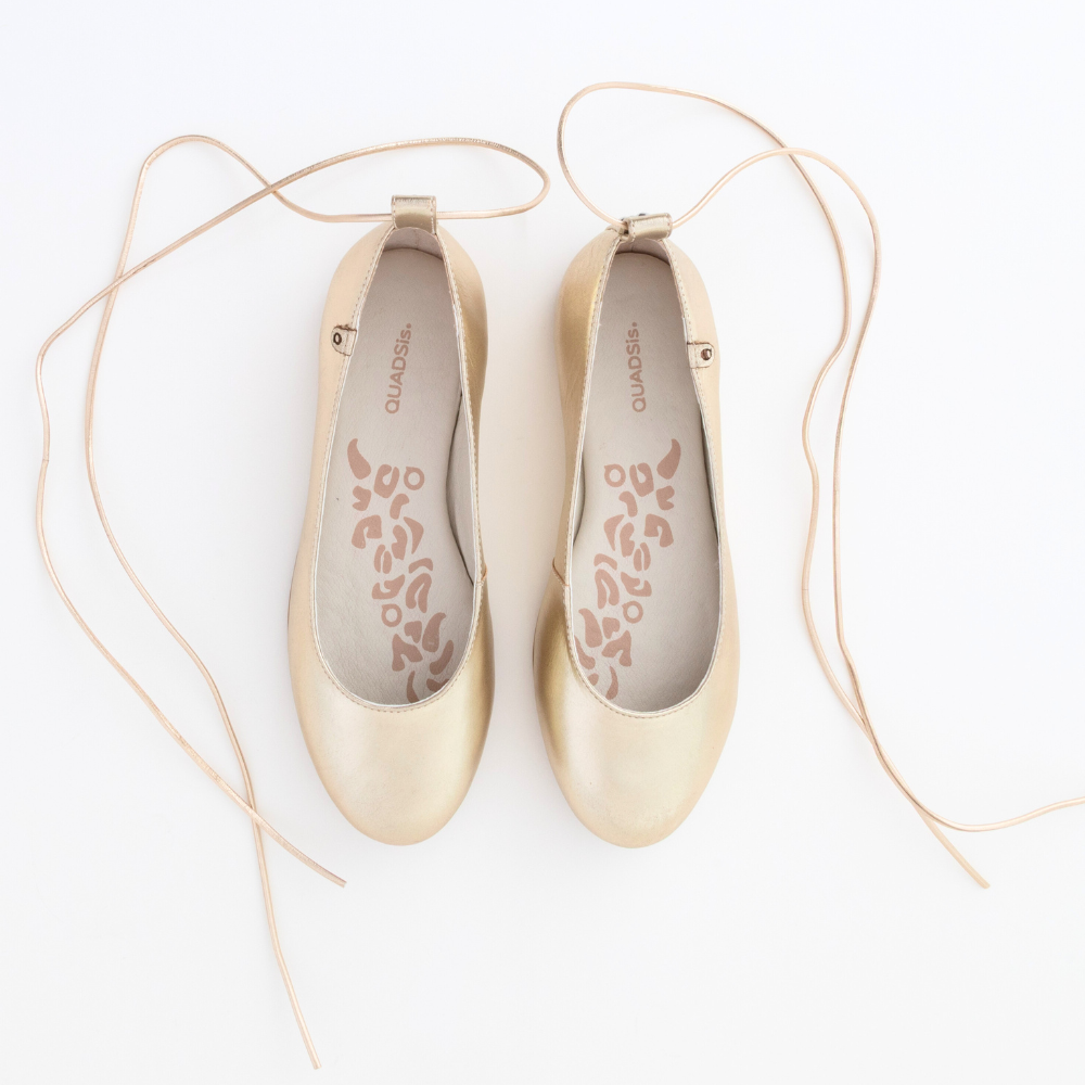 QUADSis Ballet flat Gold. Comfortable, sustainable, and lightweight with removeable leather tie. Genuine leather in black and soft gold.